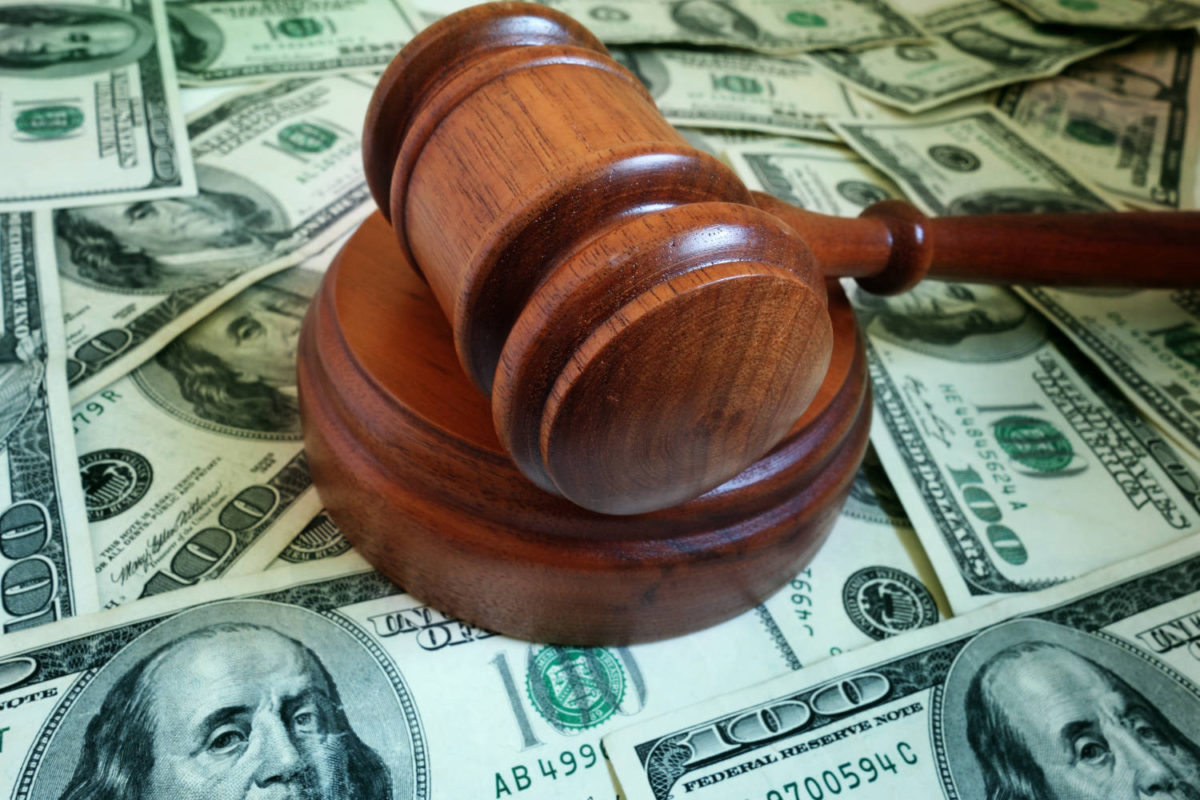 closeup of a legal gavel on US cash